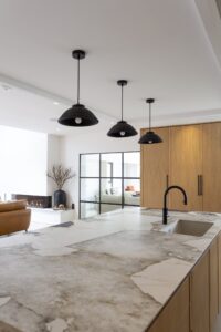 Close view of the Verta island sink and veined worktop