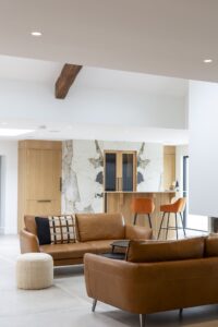 Verta cabinetry and home bar beside a tan sofa