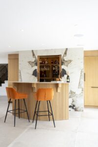 Verta home bar with pocket doors open above the counter