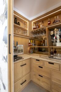 Verta walk-in pantry with oak drawers and illuminated shelving