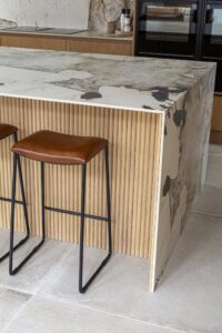 Ribbed oak panelling beneath the Verta island breakfast bar